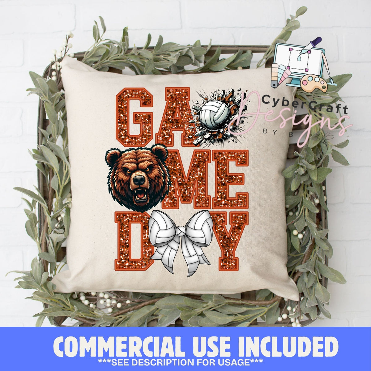 A square decorative throw pillow with a beige fabric base, featuring a glittery orange 'GAME DAY' text design, a brown bear illustration, a volleyball, and a white bow. The pillow is styled inside a rustic wooden crate surrounded by green foliage, with a blue banner at the bottom reading 'COMMERCIAL USE INCLUDED' and a 'Cybercraft designs' watermark.