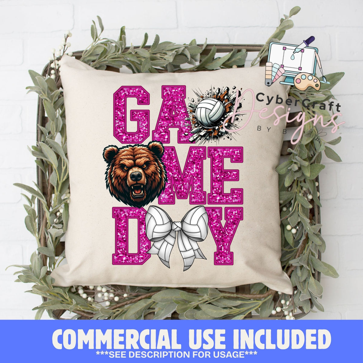 A square beige throw pillow with a glittery pink 'GAME ME DAY' volleyball graphic, featuring a brown bear illustration and a white bow design, displayed in a decorative green wreath on a white brick wall. A blue banner at the bottom reads 'COMMERCIAL USE INCLUDED'.
