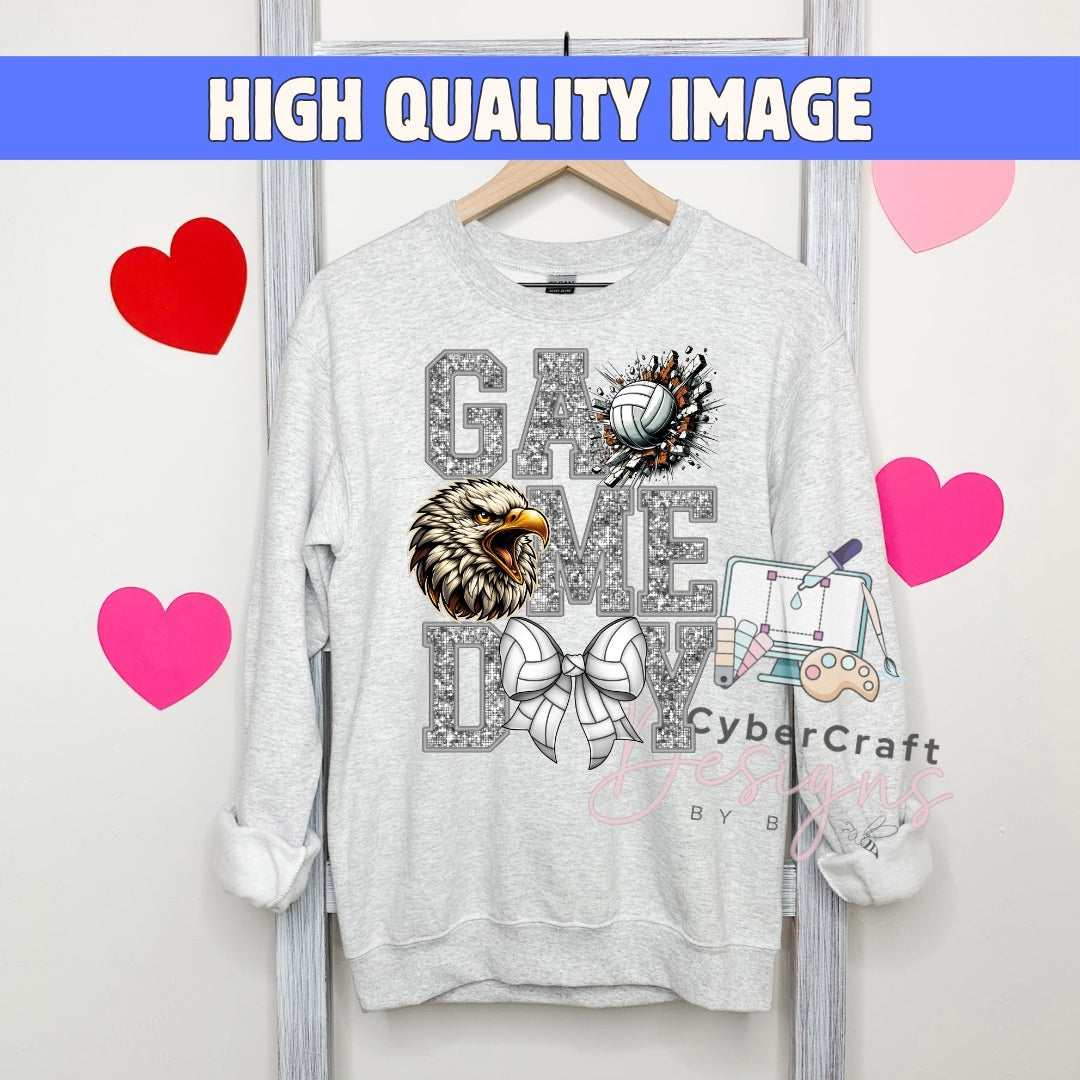 A light gray crewneck sweatshirt hanging on a wooden hanger, featuring a 'Game Day' graphic with a glittery eagle head, volleyball, bow tie, and a cartoon character. The image has a blue banner at the top reading 'HIGH QUALITY IMAGE' and pink heart graphics on a white background.