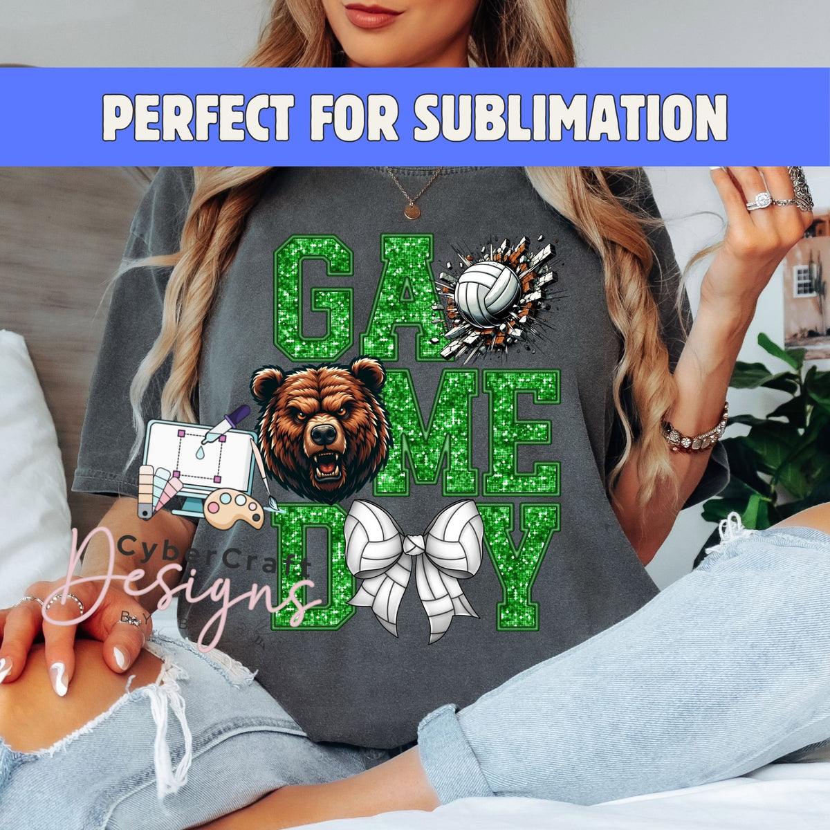 A woman wearing a dark gray graphic t-shirt with a green glittery 'GAME DAY' design featuring a bear head, volleyball, and cheerleader bow. A blue banner at the top reads 'PERFECT FOR SUBLIIMATION' and a watermark 'CyberCraft Designs' is visible.