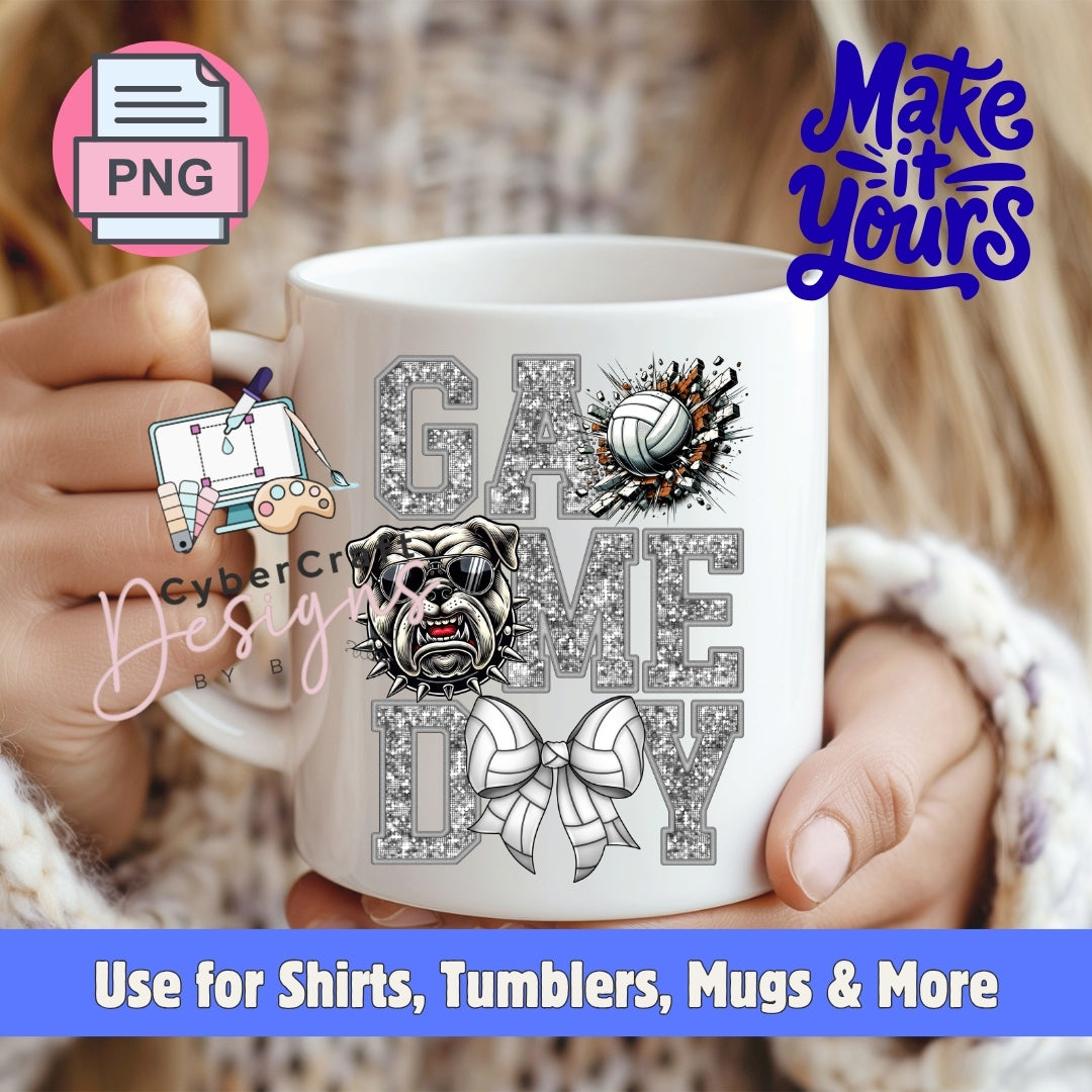 A white ceramic mug held by two hands, featuring a glittery gray 'GAME DAY' design with a bulldog, volleyballs, and a bow tie. The background shows a blurred person wearing a knit sweater.