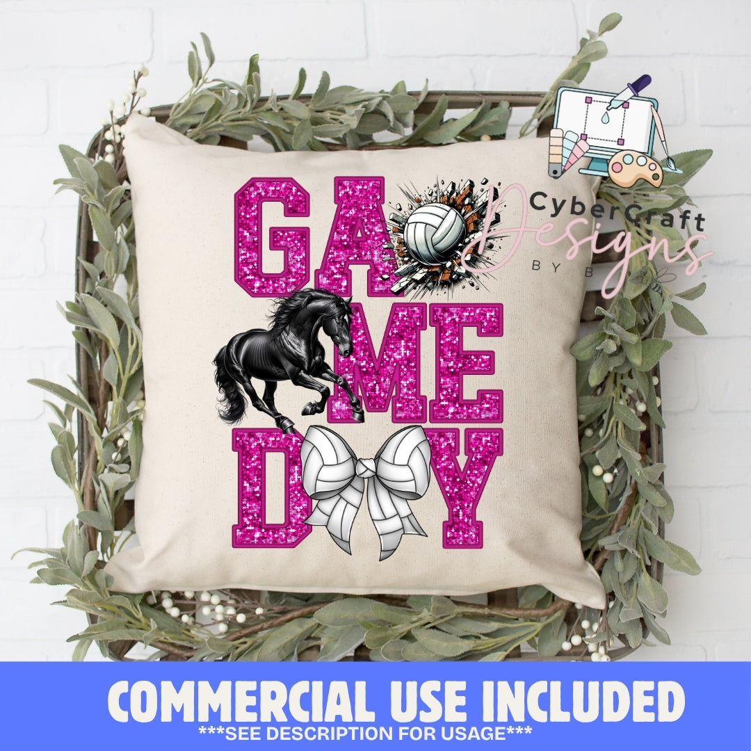 A square beige throw pillow displayed in a decorative wooden crate with greenery, featuring large glittery pink text reading 'GAME DAY,' a black horse graphic, a volleyball, and a white bow. A blue banner at the bottom says 'COMMERCIAL USE INCLUDED' and a 'Cybercraft designs' watermark/logo appears on the pillow.