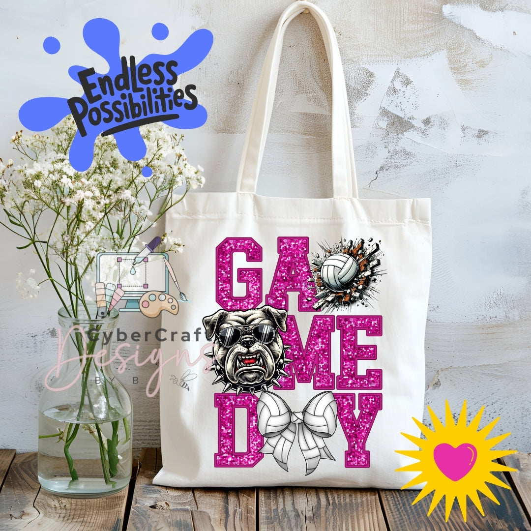 A white canvas tote bag with a 'Game Day' graphic featuring a bulldog, a pink glitter-style volleyball, and a bow. The bag is displayed on a rustic wooden table next to a glass vase of baby's breath, with decorative digital overlays including 'Endless Possibilities' and 'CyberCraft Designs'.