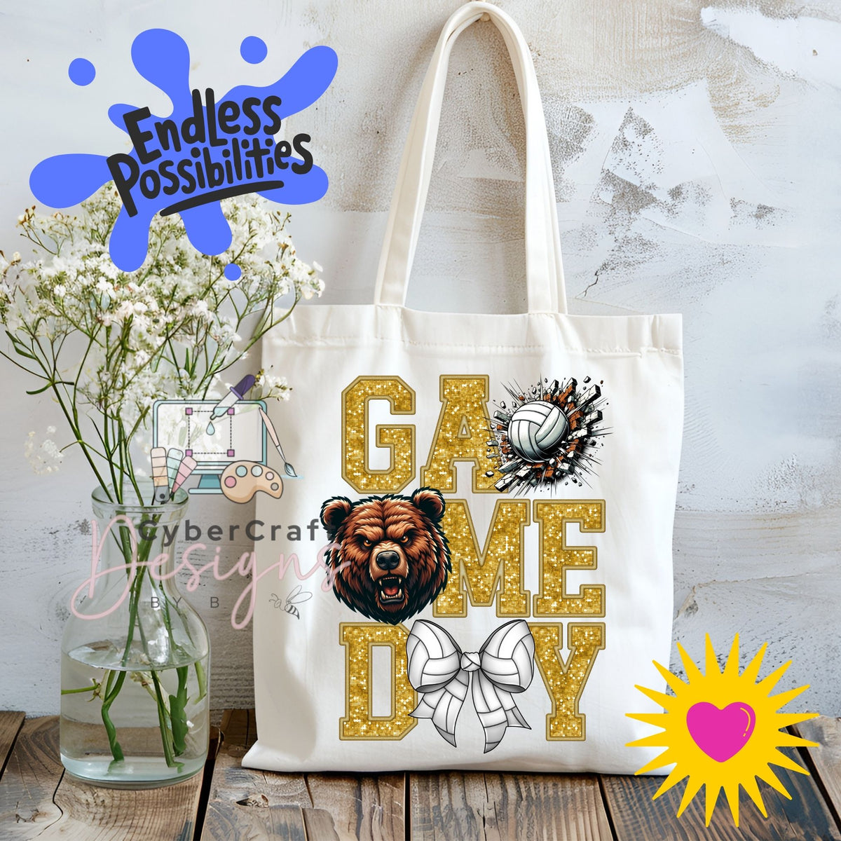 A white canvas tote bag with a custom 'Game Day' graphic featuring a bear head, volleyball, and bow tie, displayed on a rustic wooden table next to a vase of baby's breath with decorative overlays.