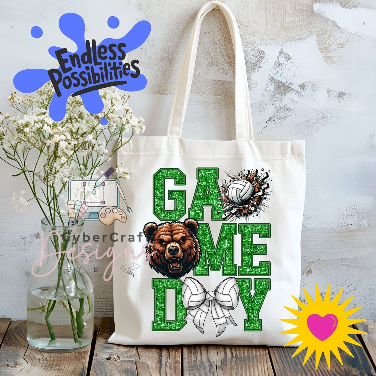 A white canvas tote bag with 'GAME DAY' printed in glittery green letters, featuring a brown bear head graphic, a volleyball, and a white bow. The bag is displayed on a rustic wooden table next to a glass vase of white flowers, with decorative digital overlays including 'Endless Possibilities' and 'CyberCraft Designs'.