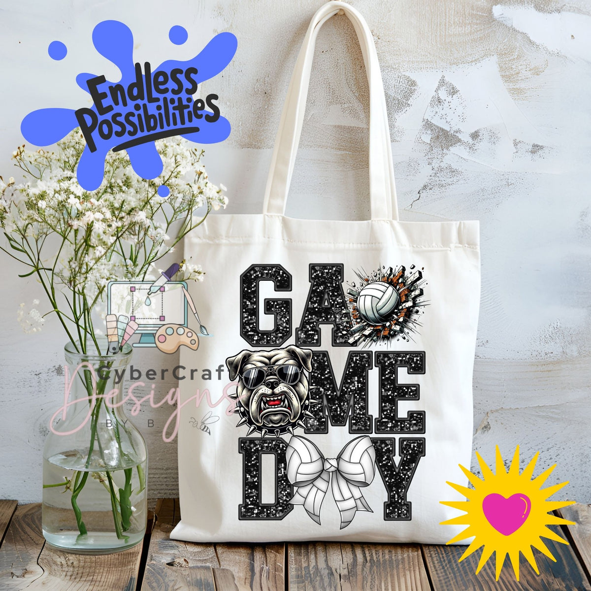 A white canvas tote bag with a black and white graphic print reading 'GAME DAY' with a bulldog, volleyball, and bow tie. The bag is displayed on a rustic wooden table next to a glass vase of baby's breath, with decorative digital overlays including 'Endless Possibilities' and 'CyberCraft Designs'.